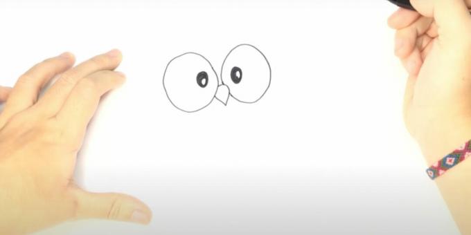 Wie zeichnet man eine Eule: Zeichnen Sie die Augen und den Schnabel