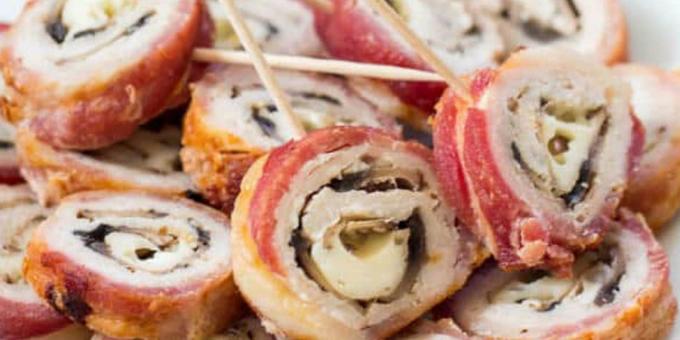 Schweinefleisch im Ofen: Rolls von Schweinefleisch in Speck gefüllt mit Pilzen und Käse eingewickelt